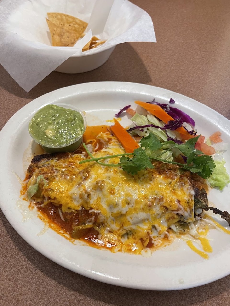 Mexican menu featuring tacos and burritos.
