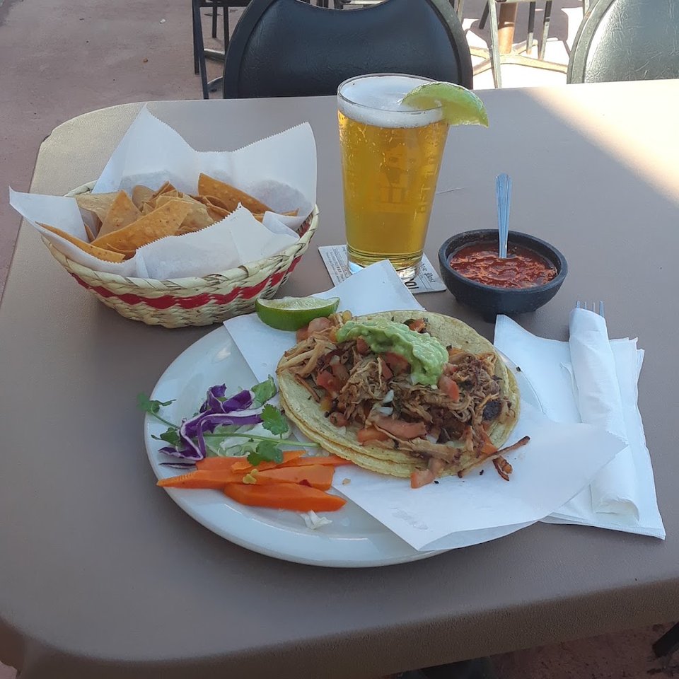 Mexican menu featuring tacos and burritos.