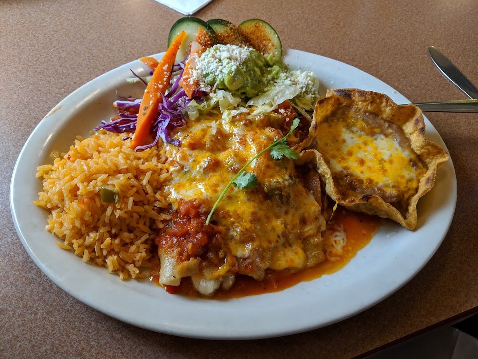 Mexican menu featuring tacos and burritos.