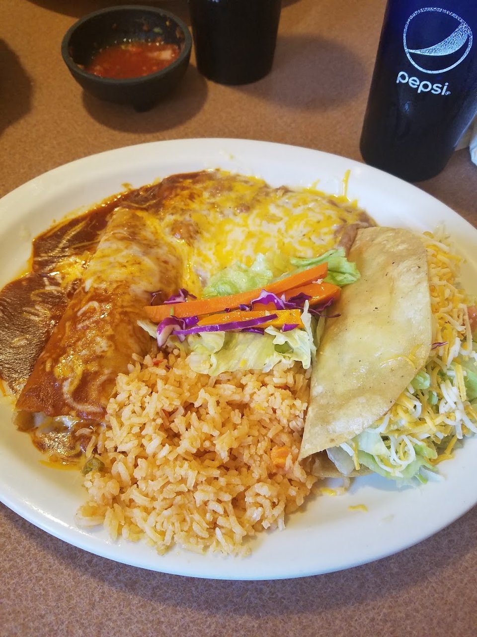Mexican menu featuring tacos and burritos.